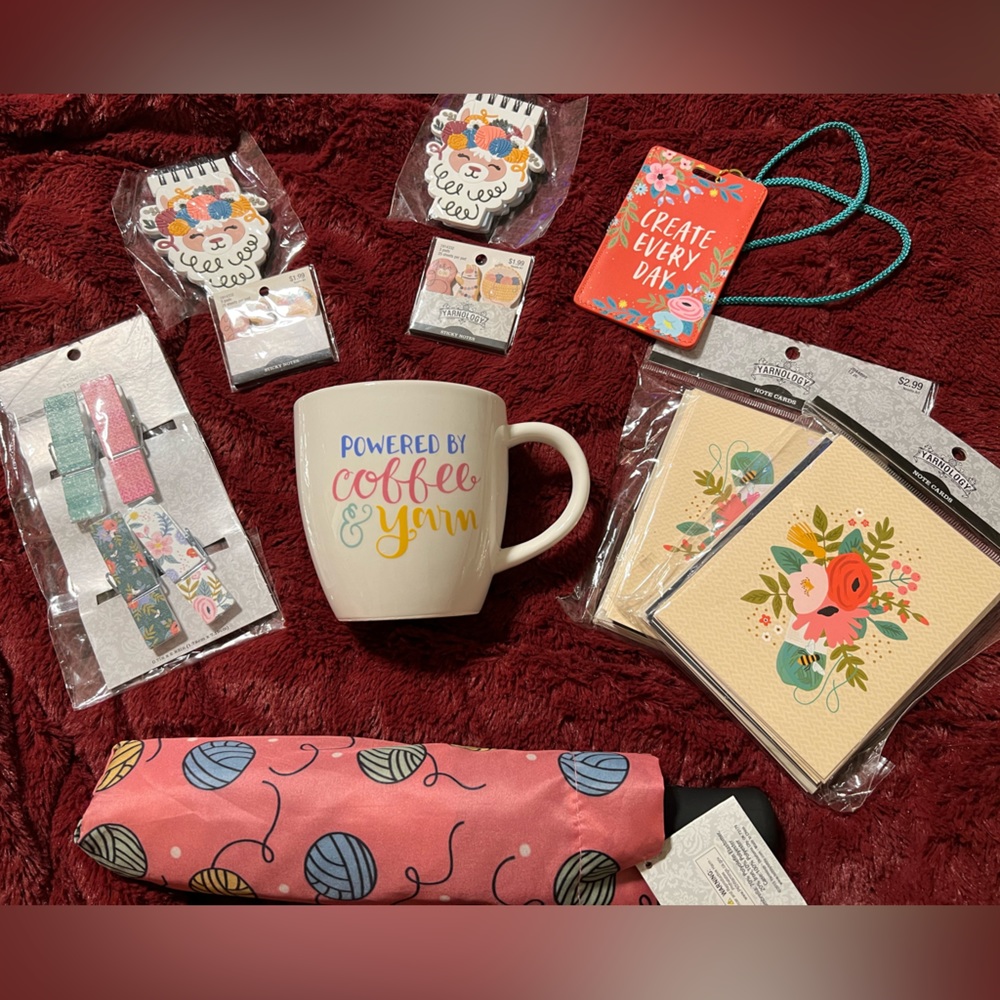 Bundle with various items from note cards to an umbrella